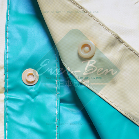 Yellow plastic hooded rain mac button